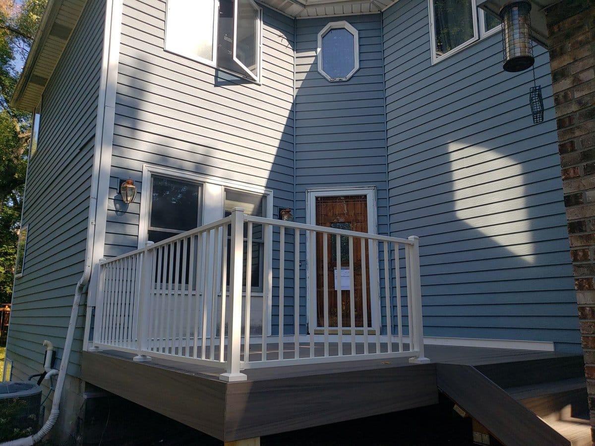 Composite deck addition with white railing