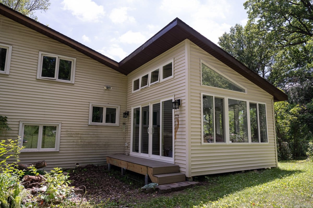 Sunroom addition exterior -- new construction attached to existing home