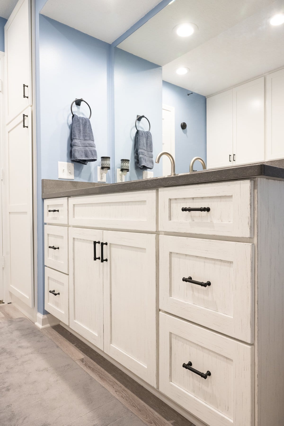 White distressed vanity with charcoal quartz countertop