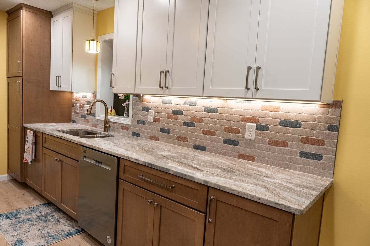 Brick tile backsplash with under-cabinet lighting